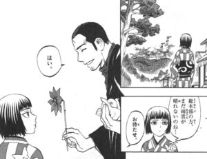 夜未に風車のおもちゃをプレゼントする正守